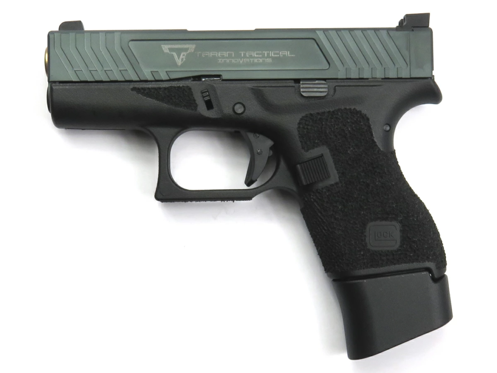 Best Guns for Small Hands (2026): 10 Pistols That Actually Fit 13 Glock 43 9mm slim subcompact concealed carry pistol combat ready stance product photo
