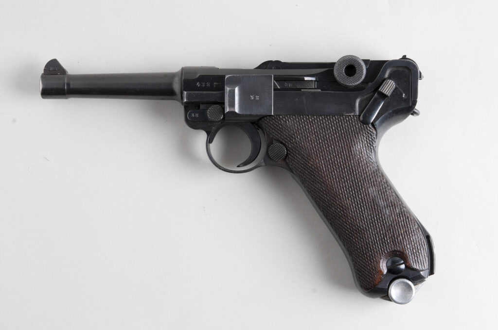 Why Does Everybody Use 9mm? The Complete Story (2026) 7 Luger P08 pistol — the original chambering platform for the 9x19 Parabellum cartridge, adopted by the German Army in 1908