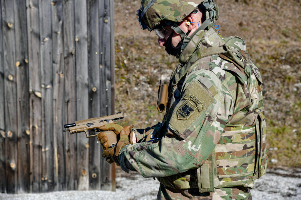 Concealed Carry Tips and Techniques: The Practical Guide (2026) 8 U.S. Army soldier on the firing line during M17 pistol qualification — the kind of consistent draw practice that produces sub-1.5-second presentations
