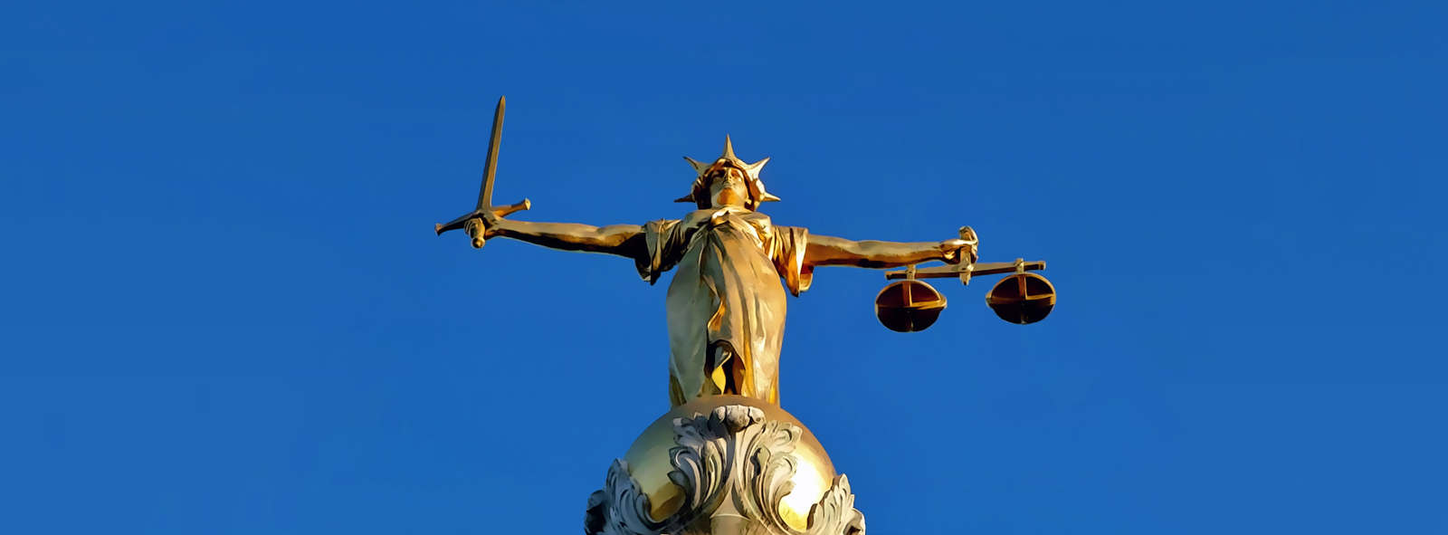 The Ethics of Lethal Force in Self-Defense: A Gun Owner's Guide (2026) 7 Lady Justice statue at the Old Bailey, London — the iconic figure of impartial justice holding scales and sword