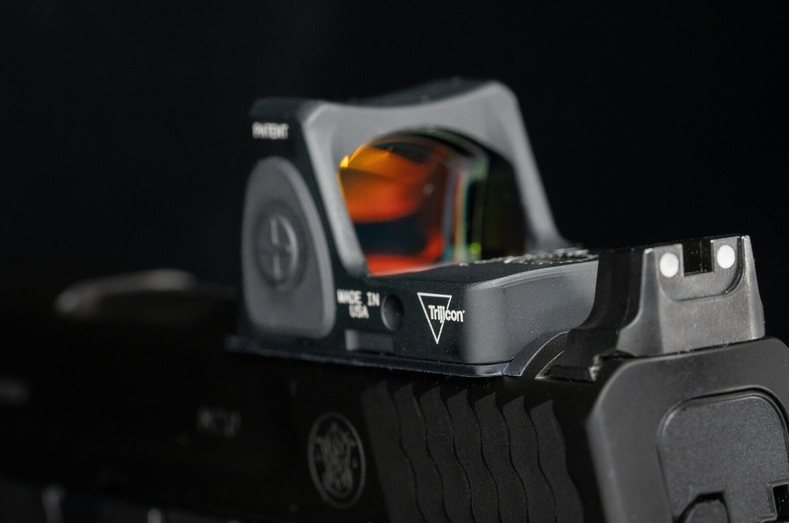 Trijicon RMR red-dot pistol optic mounted on a Smith & Wesson M&P 2.0 — the optic revolution that doubled hit probability at distance