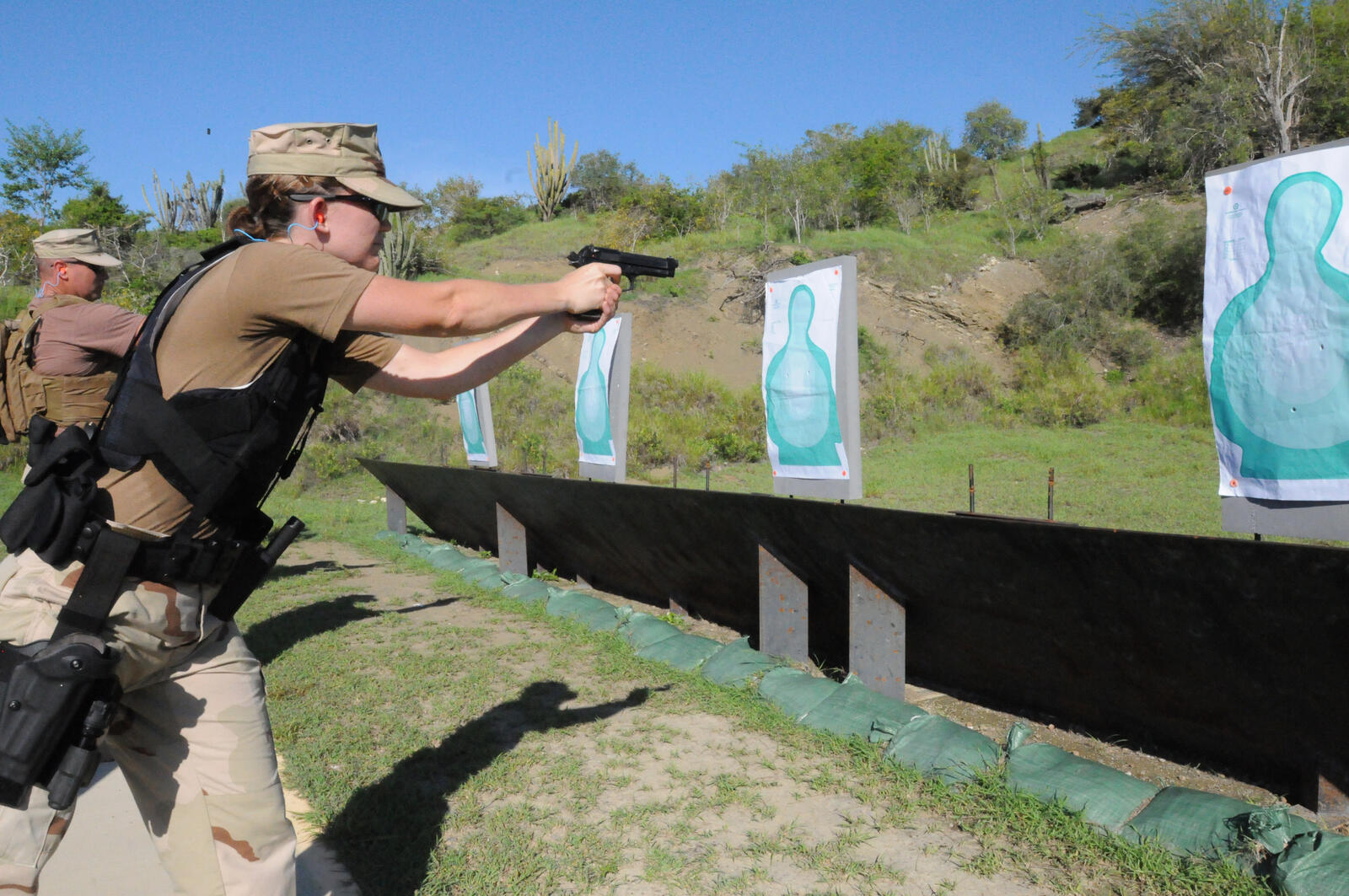 U.S. Coast Guard personnel training on the firing range — the kind of practice that translates to home-defense competence under stress
