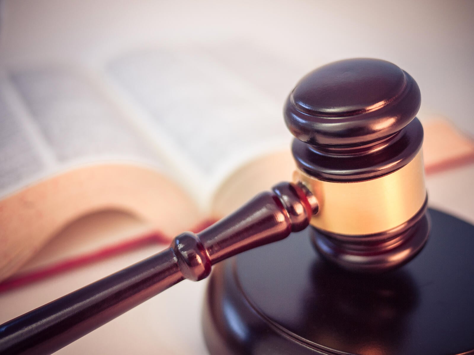 What Happens After a Defensive Shooting? Legal Guide (2026) 5 Legal gavel and open law book — the courtroom framework that follows every defensive shooting