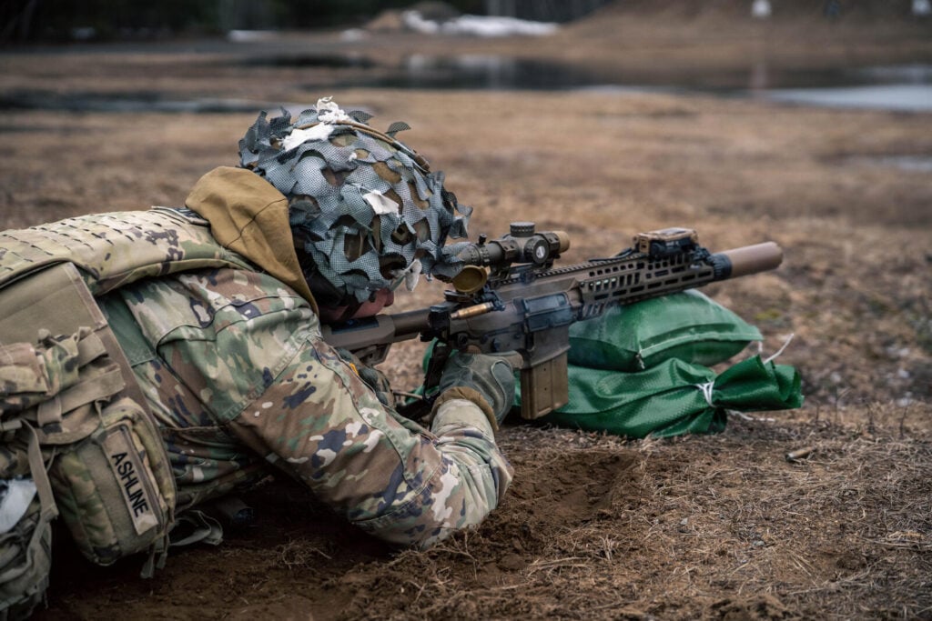 Non-commissioned officers of 1-32 Infantry test the SIG XM7 rifle and XM250 automatic rifle during Next Generation Squad Weapon evaluation