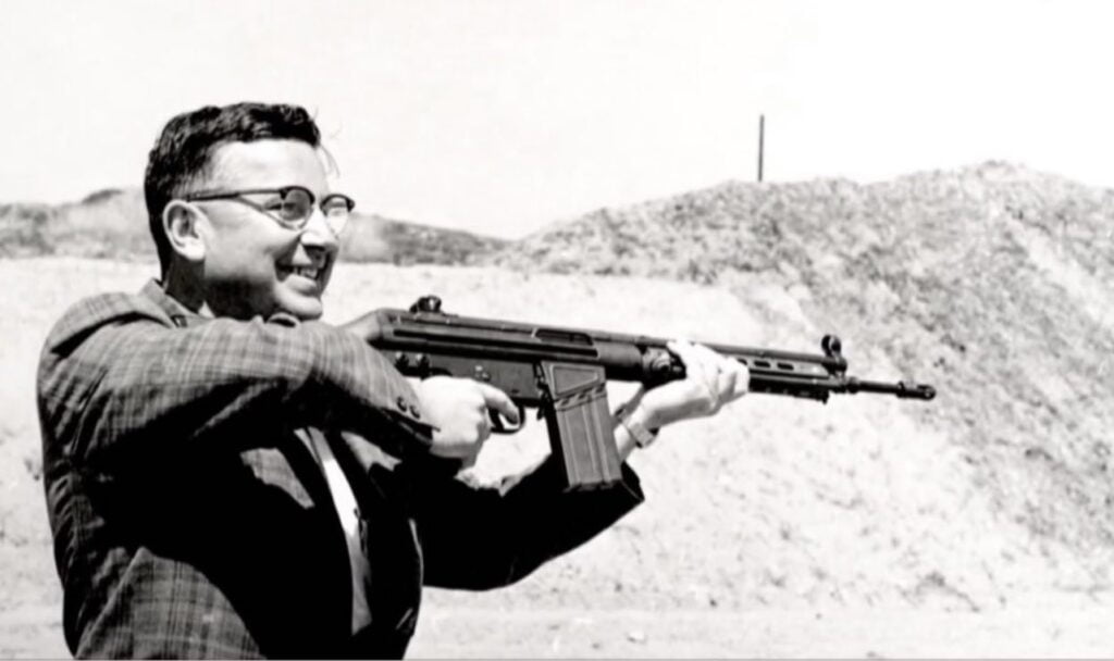 Eugene Stoner shows off his AR-15 rifle, the rifle that changed the world.