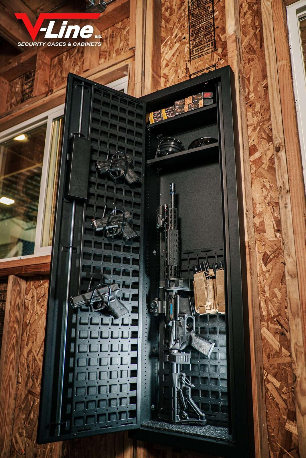 V-Line Tactical Closet Vault recessed into a stud wall with a MOLLE door panel holding pistols and a rifle inside