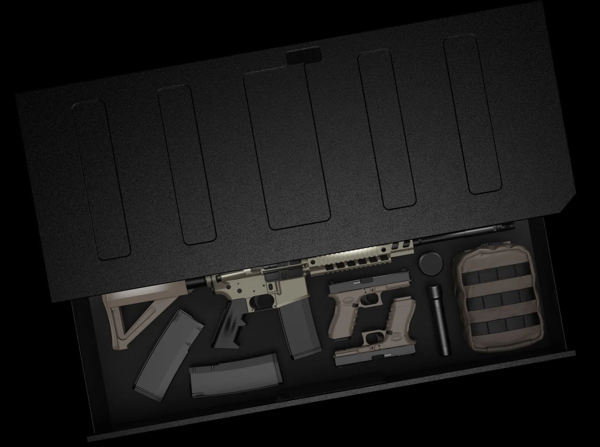 Vaultek ViSN RS Slider under-bed drawer open, holding a rifle, pistols, magazines and a pouch in foam