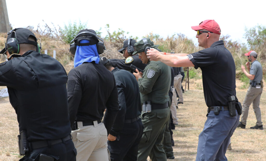 When to Draw Your Concealed Carry Gun: The Legal and Tactical Line (2026) 5 FBI agents conducting pistol marksmanship training with police forces at TRADEWINDS 24