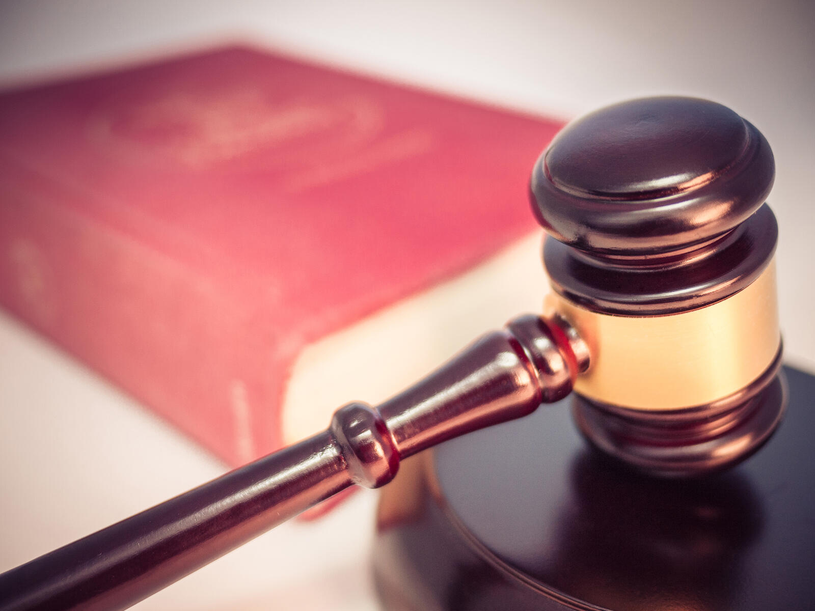 When to Draw Your Concealed Carry Gun: The Legal and Tactical Line (2026) 1 Legal gavel and closed law book — the legal framework that governs every concealed carry draw