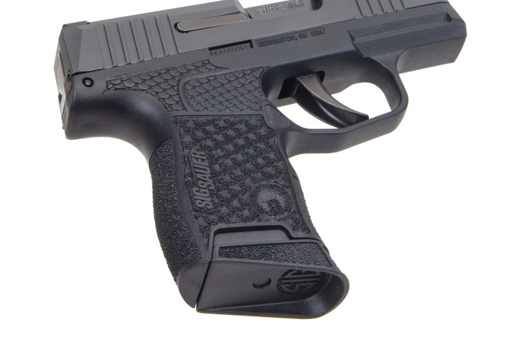 Buy a Sig Sauer P365 With a Manual Safety! 3 Grayguns laser-etched custom stipple. It