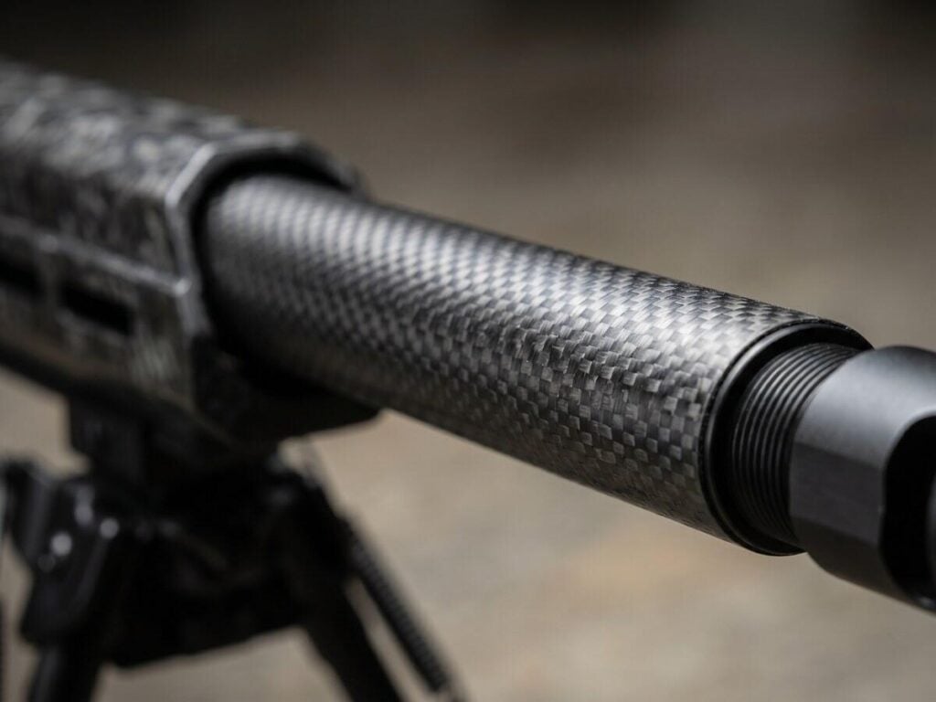 Christensen Arms MPR Review (2026): 500 Round Test of the Carbon Fiber Precision Rifle 8 Macro close-up of Christensen Arms MPR carbon fiber wrapped barrel showing the diagonal weave pattern and threaded muzzle brake