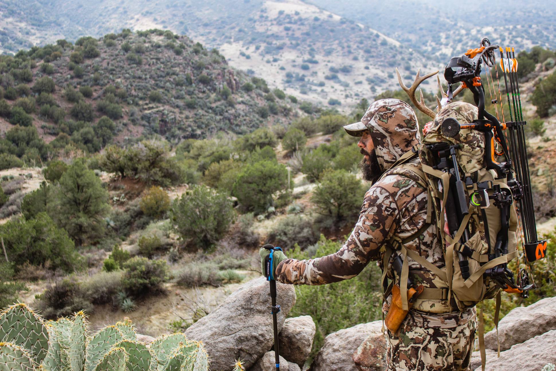 Public Land Hunting (2026): Finding It, Hunting It, Beating the Pressure 1 Western public land mountain vista at dawn with lone hunter silhouette on ridgeline, backcountry hunting scene