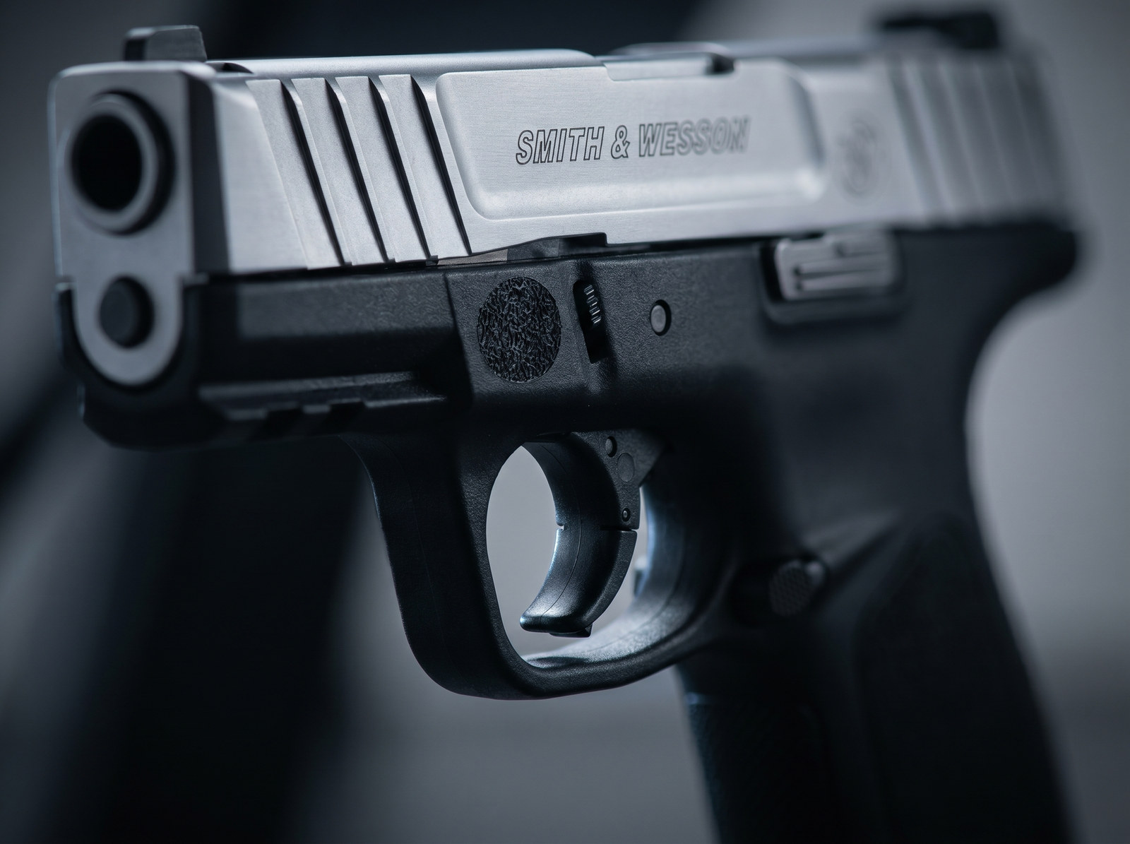 S&W SD9 VE Review (2026): 500 Round Test of the Cheapest Smith on the Shelf 4 Macro detail of the Smith and Wesson SD9 VE Self Defense Trigger blade and front slide cocking serrations with brushed silver slide engraving