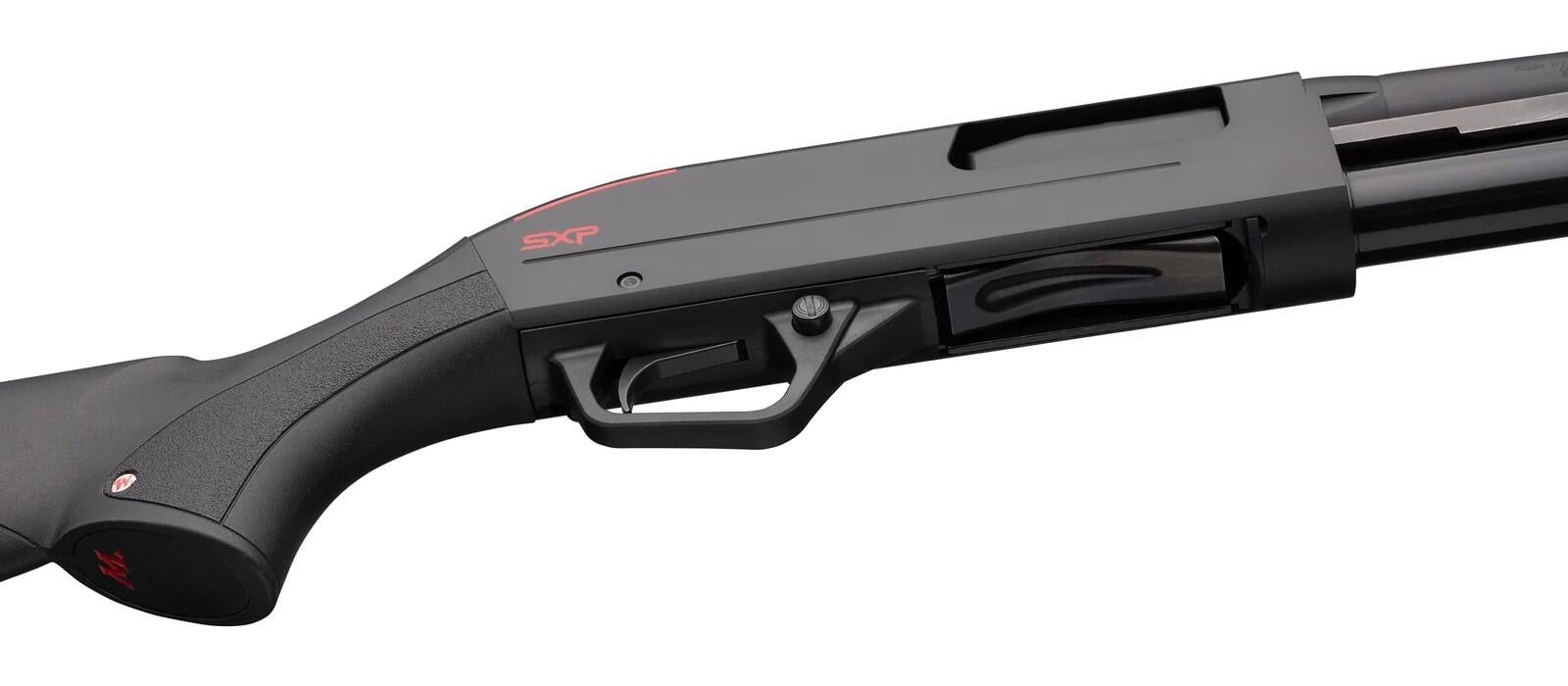Winchester SXP Defender Review (2026): 500 Round Test of the Fastest Pump Shotgun 11 Winchester SXP Defender with action open, showing twin action bars and chamber