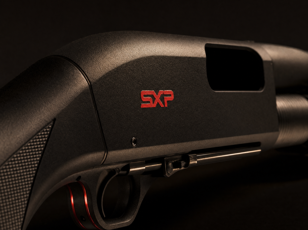 Winchester SXP Defender Review (2026): 500 Round Test of the Fastest Pump Shotgun 10 Winchester SXP Defender receiver and action close-up showing inertia-assisted mechanism