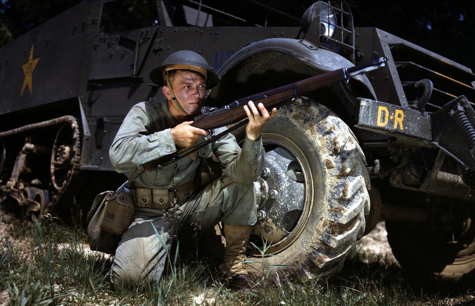 US Army infantryman in 1942 at Fort Knox, Kentucky training with the M1 Garand semi-automatic battle rifle in walnut stock and parkerized steel finish, period black-and-white photograph from WWII basic-training documentation (US National Archives, public domain via Wikipedia Commons)