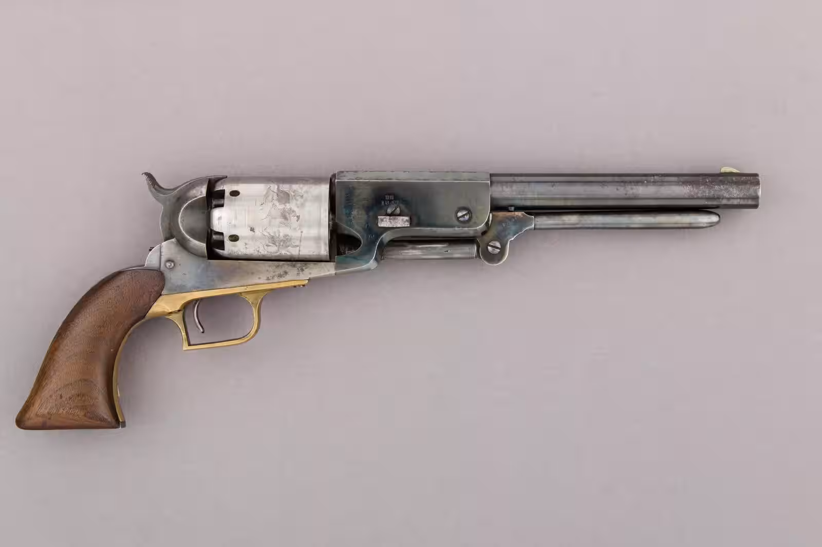 The 7 Rarest Production Guns in the World 1 An 1847 Colt Walker percussion revolver on a plain background