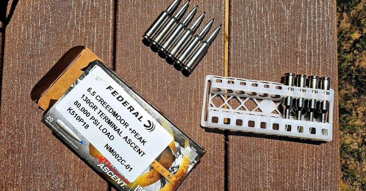 Federal 6.5 Creedmoor +Peak: A New Case That Beats 6.5 PRC (2026) 1 Federal 6.5 Creedmoor +Peak ammunition box, 130gr Terminal Ascent 80,000 psi load, with silver Peak Alloy cartridges