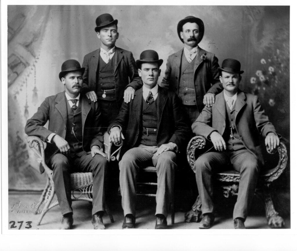 Wild West Outlaw Guns: What Billy the Kid, Jesse James and Wyatt Earp Actually Carried 5 The 1900 "Fort Worth Five" portrait. The gang posed in suits, no guns. It became their wanted poster.