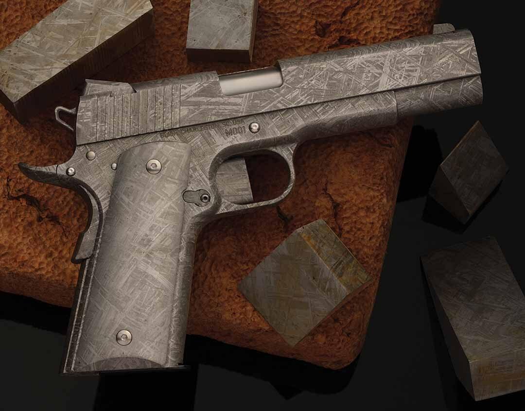 Bligh Guns Forges a 1911 From 4-Billion-Year-Old Meteorite Iron 1 The Bligh Guns Meteorite Celestial Edition 1911, serial M001, with its crystalline meteorite-iron finish surrounded by cut Muonionalusta meteorite