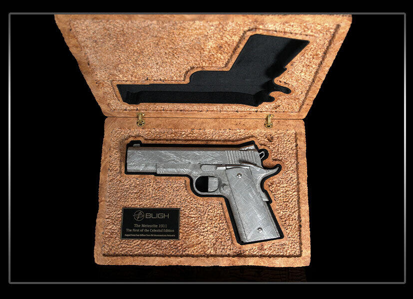 Bligh Guns Forges a 1911 From 4-Billion-Year-Old Meteorite Iron 7 The Bligh Guns Meteorite 1911 in its burl maple presentation case beside the Celestial Edition plaque