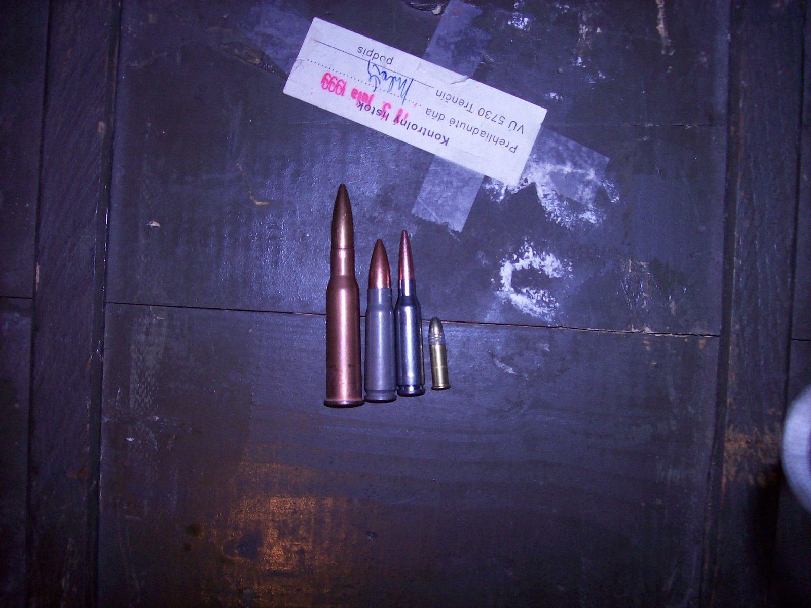 10 Firearms Myths People Still Believe (and the Truth Behind Them) 8 Steel-cased ammunition beside a brass-cased cartridge for comparison