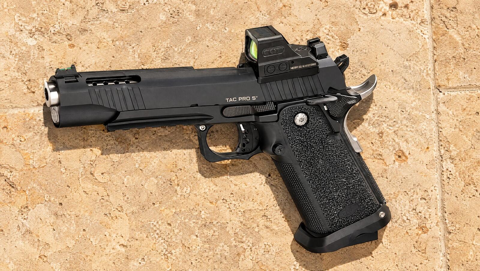 Bul Armory SAS II Tac Pro 2011 with a red dot lying on limestone tiles in hard sunlight