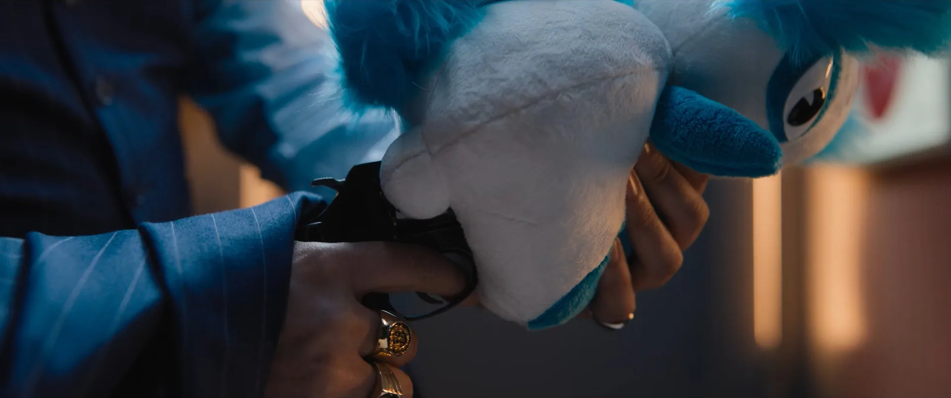 Tangerine using a Momomon plush toy as a makeshift suppressor on his Model 36 revolver in Bullet Train