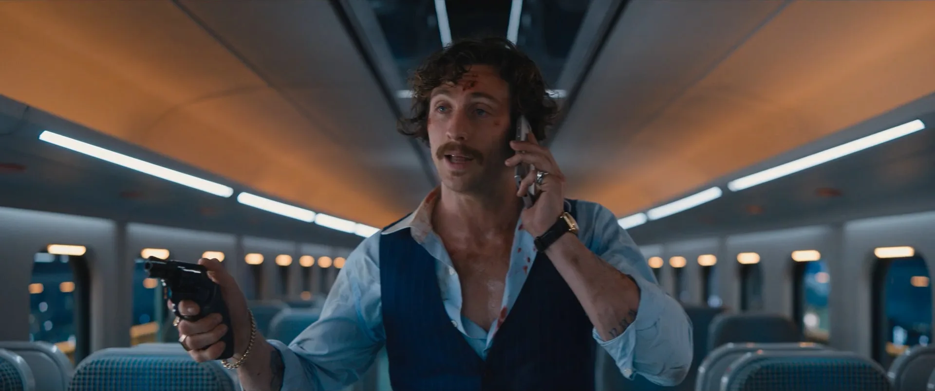 Tangerine holding his Smith and Wesson Model 36 snub-nose revolver on the train in Bullet Train