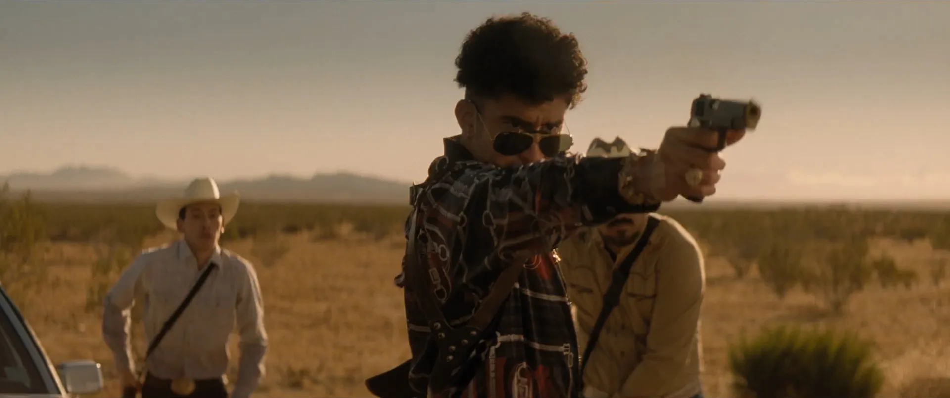 The Wolf firing his gold-accented Rock Island Armory 1911 in a Bullet Train flashback