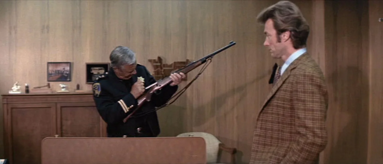 The Chief presenting Harry Callahan with a scoped Winchester Model 70 in 458 Winchester Magnum in Dirty Harry