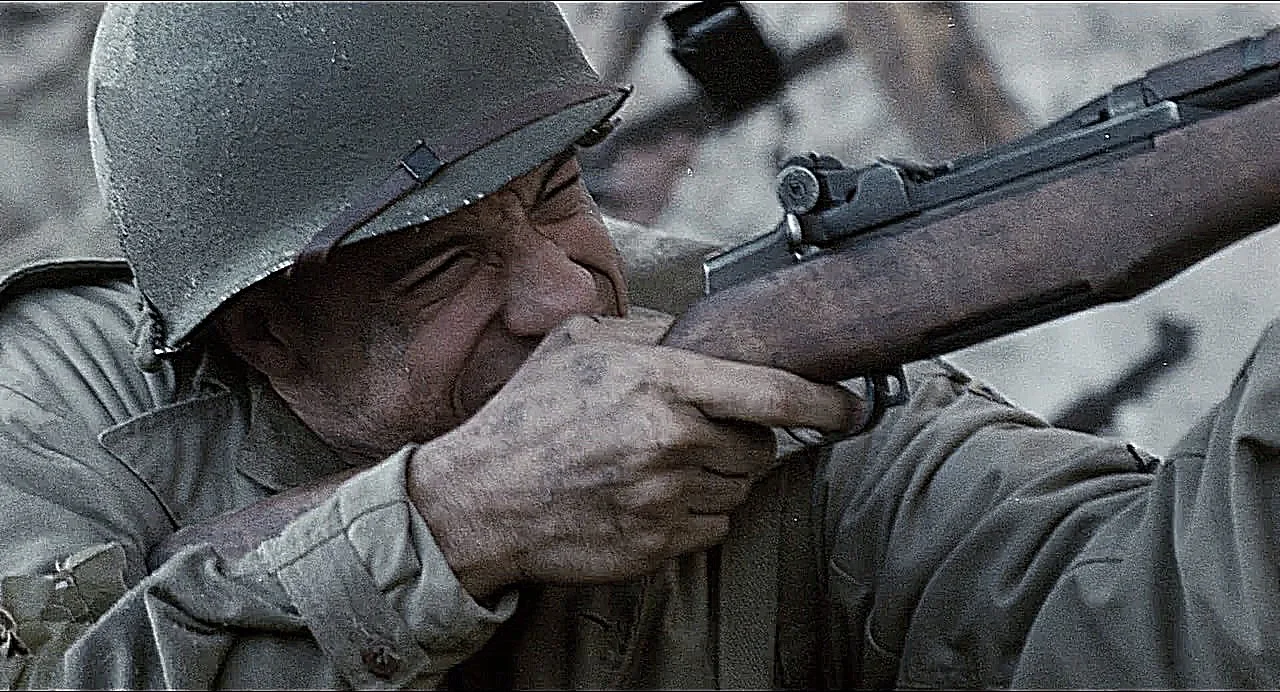 Caparzo firing his M1 Garand with the empty en bloc clip ejecting in mid air in Saving Private Ryan