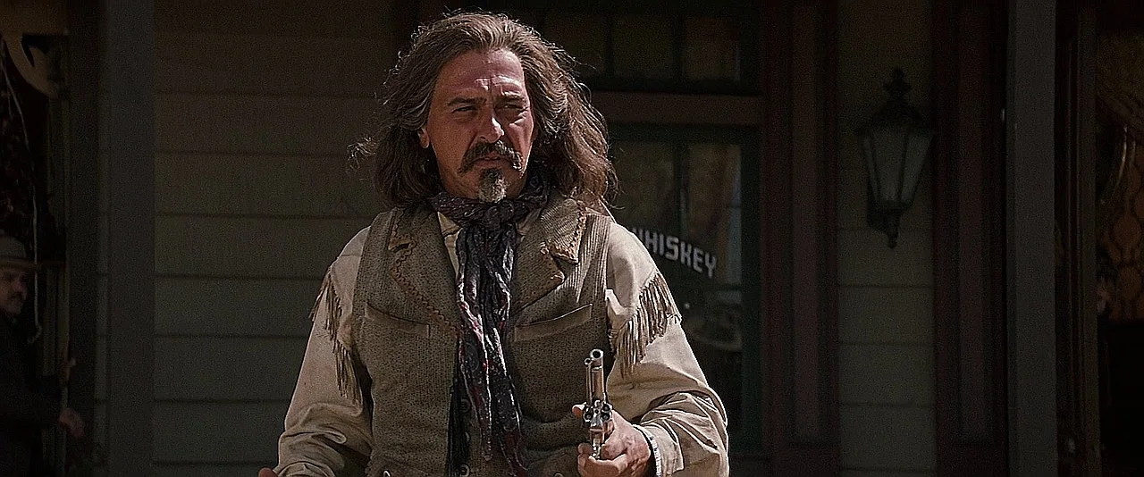 Peter Sherayko, the film armorer, in character as Texas Jack Vermillion holding a Single Action Army in Tombstone