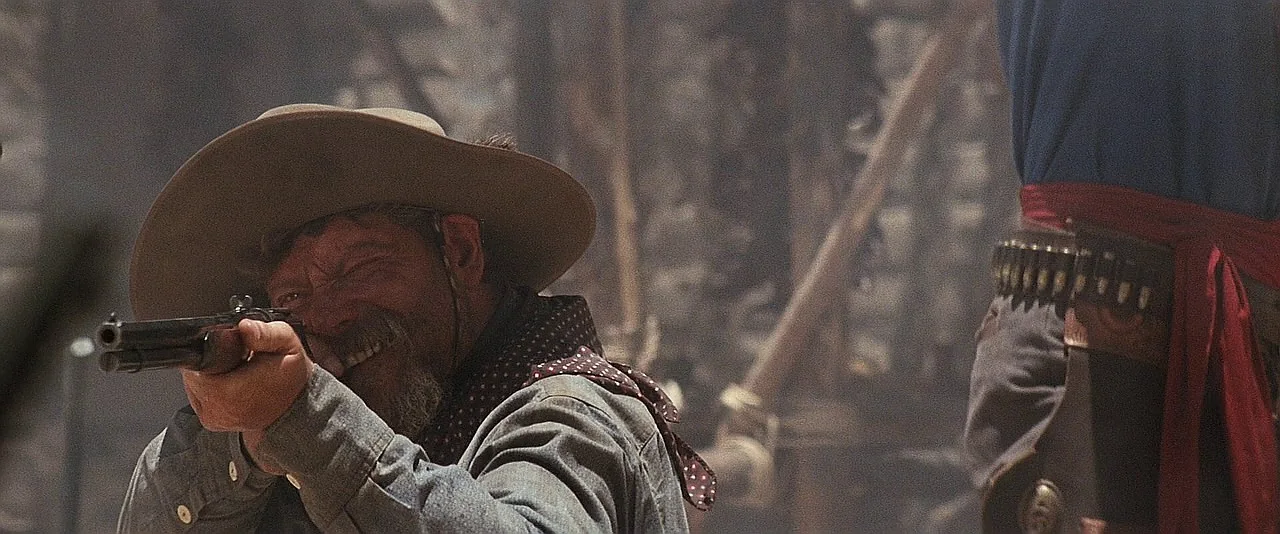 A Cowboy firing a Winchester Model 1873 lever-action rifle during the opening shootout in Tombstone
