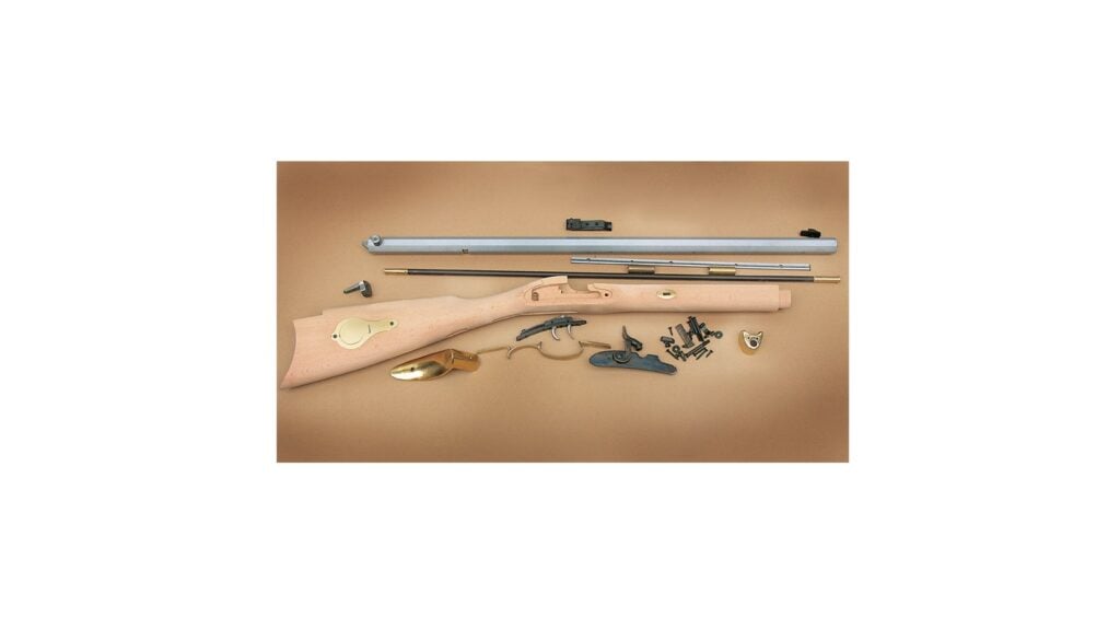 Traditions St. Louis Hawken rifle kit components including unfinished stock, barrel, brass furniture and percussion lock