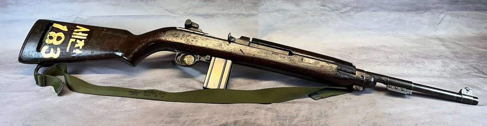 Original World War II era GI M1 Carbine with a stenciled Korea-return stock and web sling