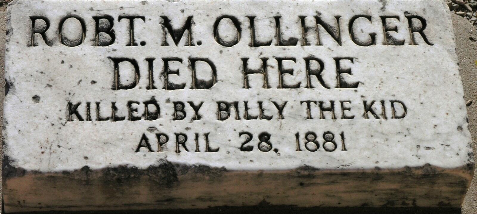 Stone marker in Lincoln, New Mexico, reading Robt. M. Ollinger died here, killed by Billy the Kid, April 28, 1881