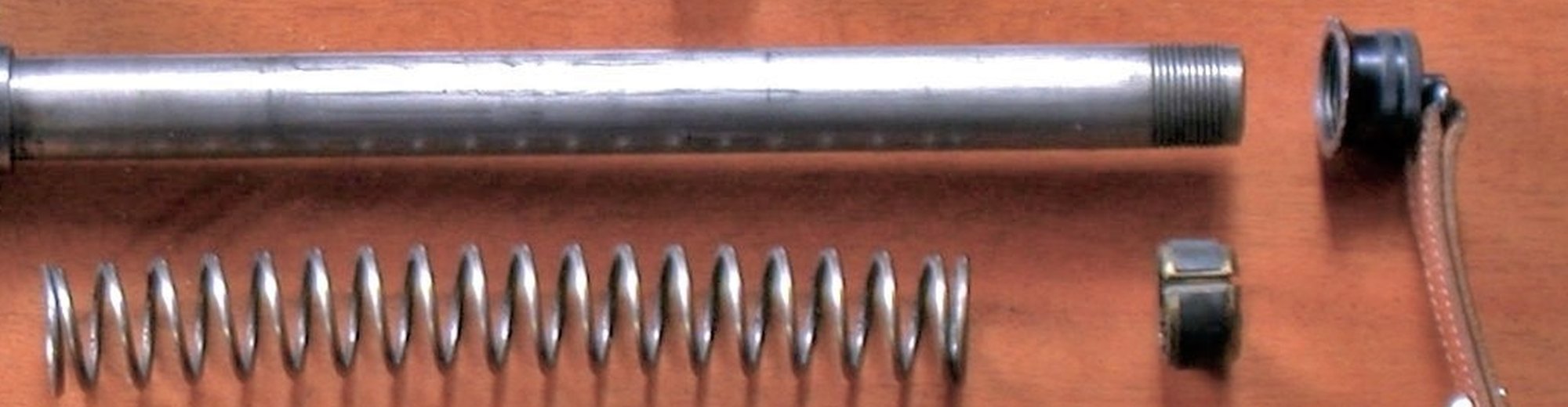 Browning Auto-5 recoil spring, magazine tube and friction ring laid out after field stripping
