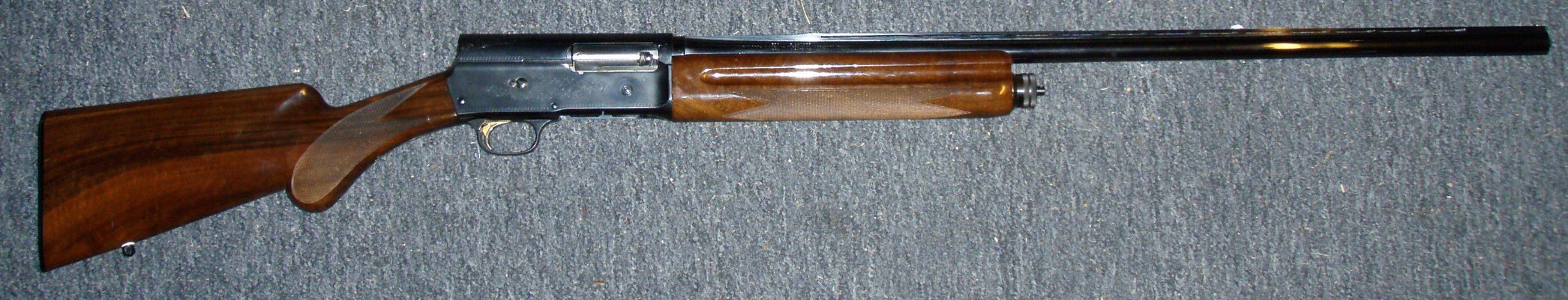 Browning Auto-5 Magnum 20 gauge shotgun with vent rib and gold trigger, right side view