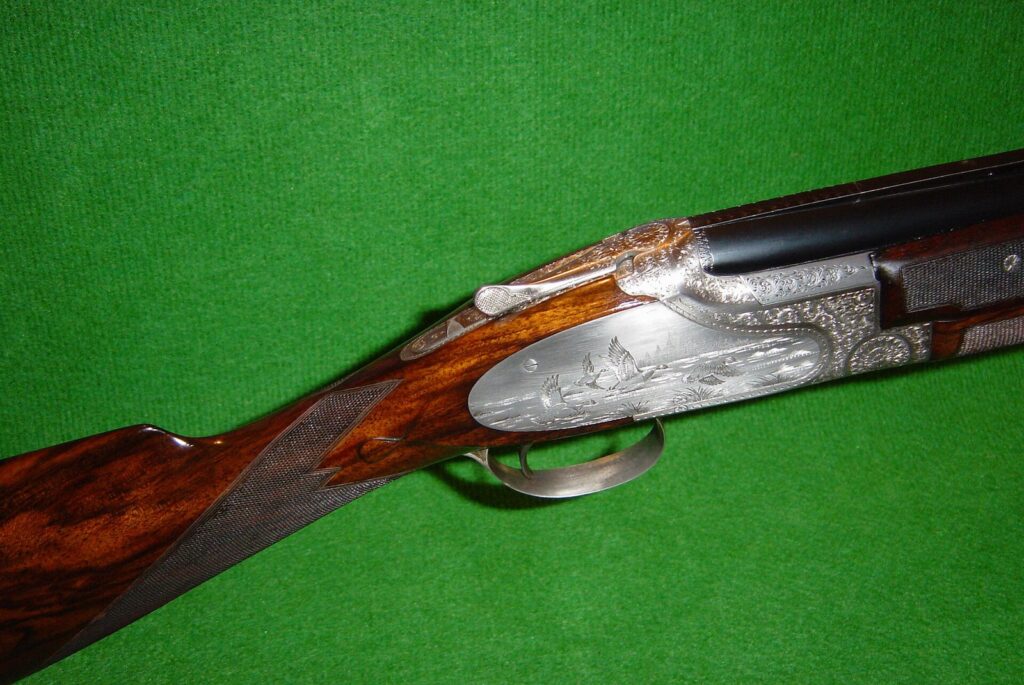 Engraved Browning B25 Superposed over-and-under 12 gauge shotgun receiver