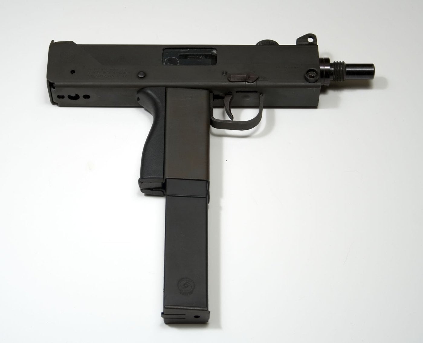 Right side of a Cobray M11/9 pistol with a long 32-round magazine inserted and a threaded barrel, on a white background