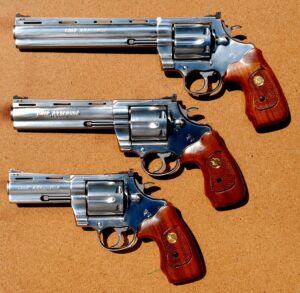 Three stainless Colt Anaconda .44 Magnum revolvers with different barrel lengths