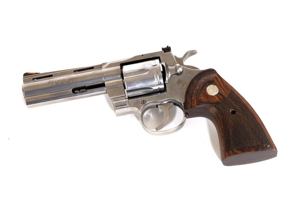 Stainless Colt Python .357 Magnum revolver with walnut grips, a grail gun for revolver fans