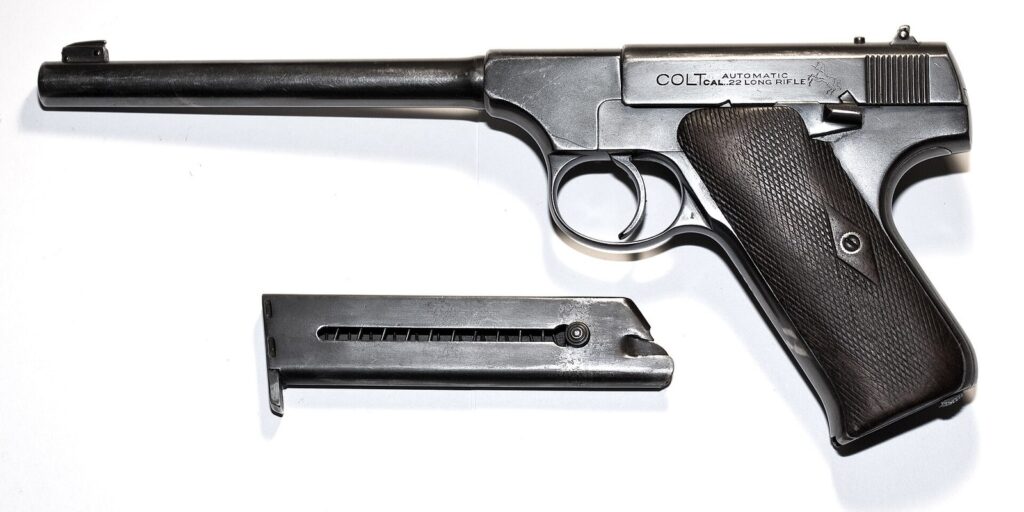 Early First Series Colt Woodsman .22 pistol with its magazine