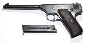 Early First Series Colt Woodsman .22 pistol with its magazine