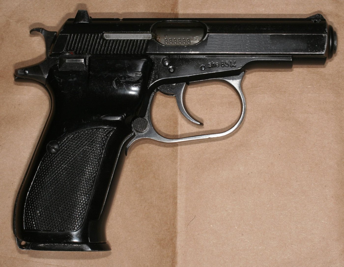 Right side of a Czech CZ 82 pistol in 9x18 Makarov with a black finish and checkered plastic grips