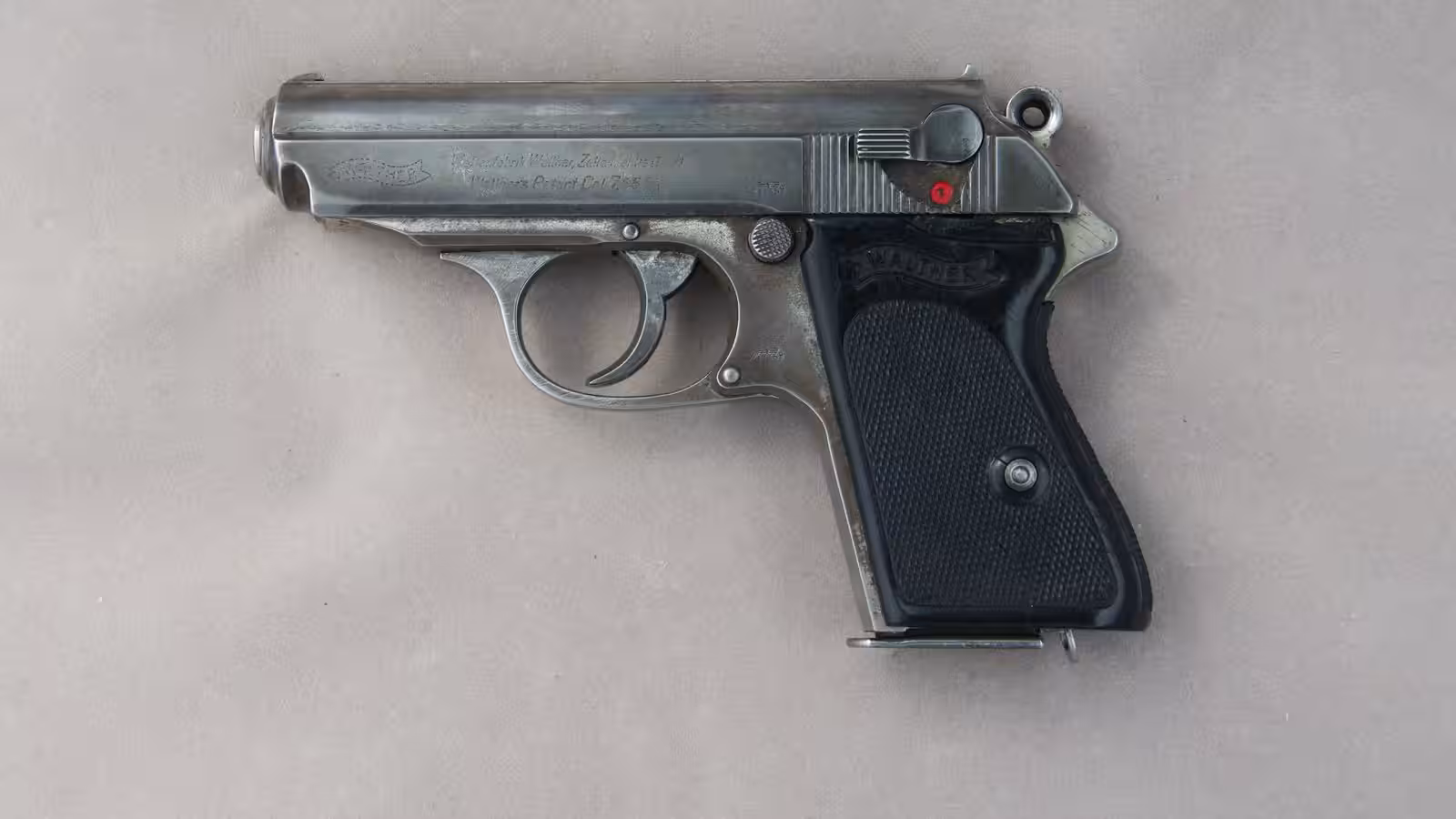 Gun values: a Walther PPK .32 made in the early 1940s, with holster wear on the slide edges and muzzle