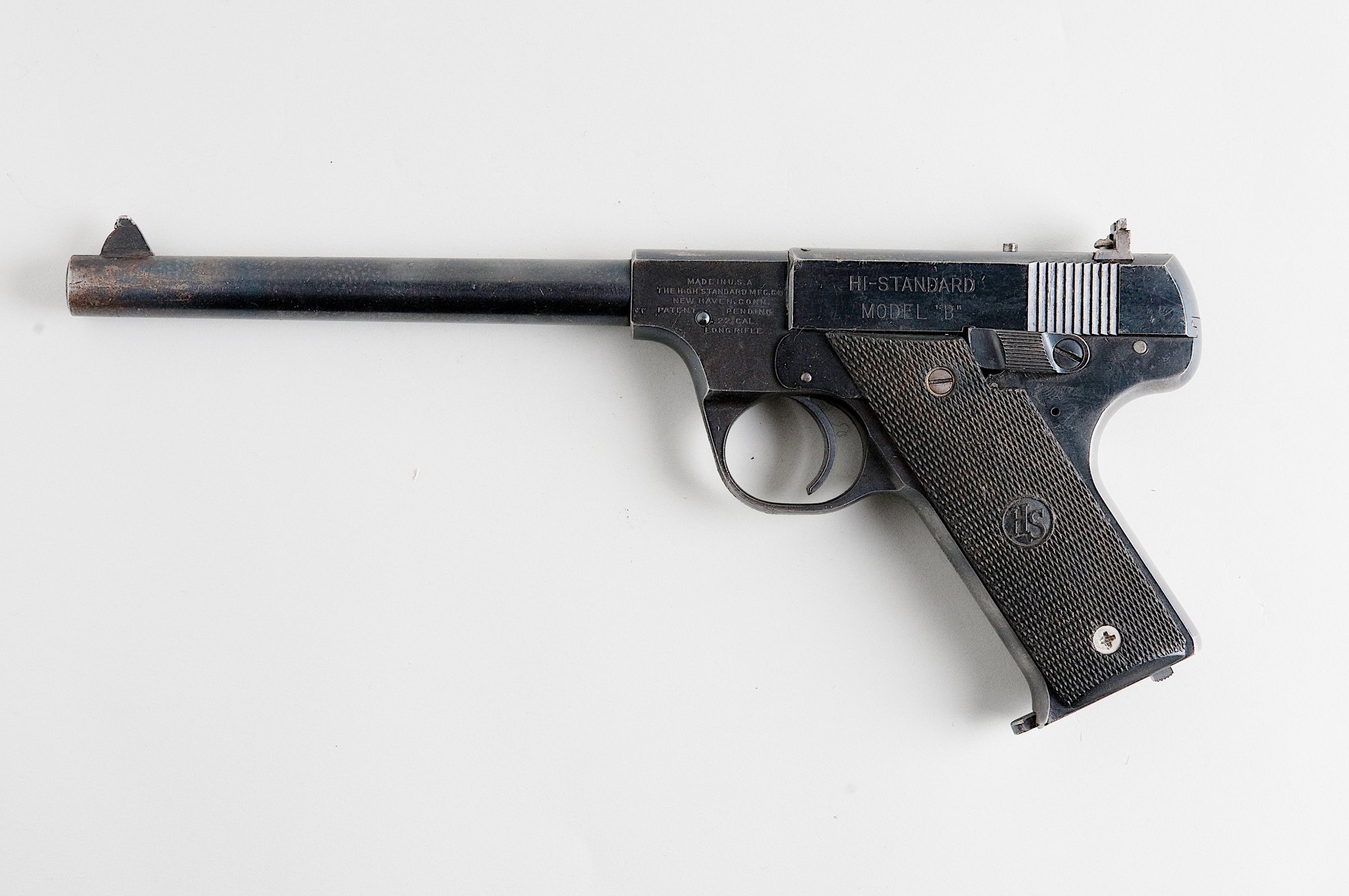Hi-Standard Model B .22 pistol, a 1930s rival to the Colt Woodsman, left side view on a gray background