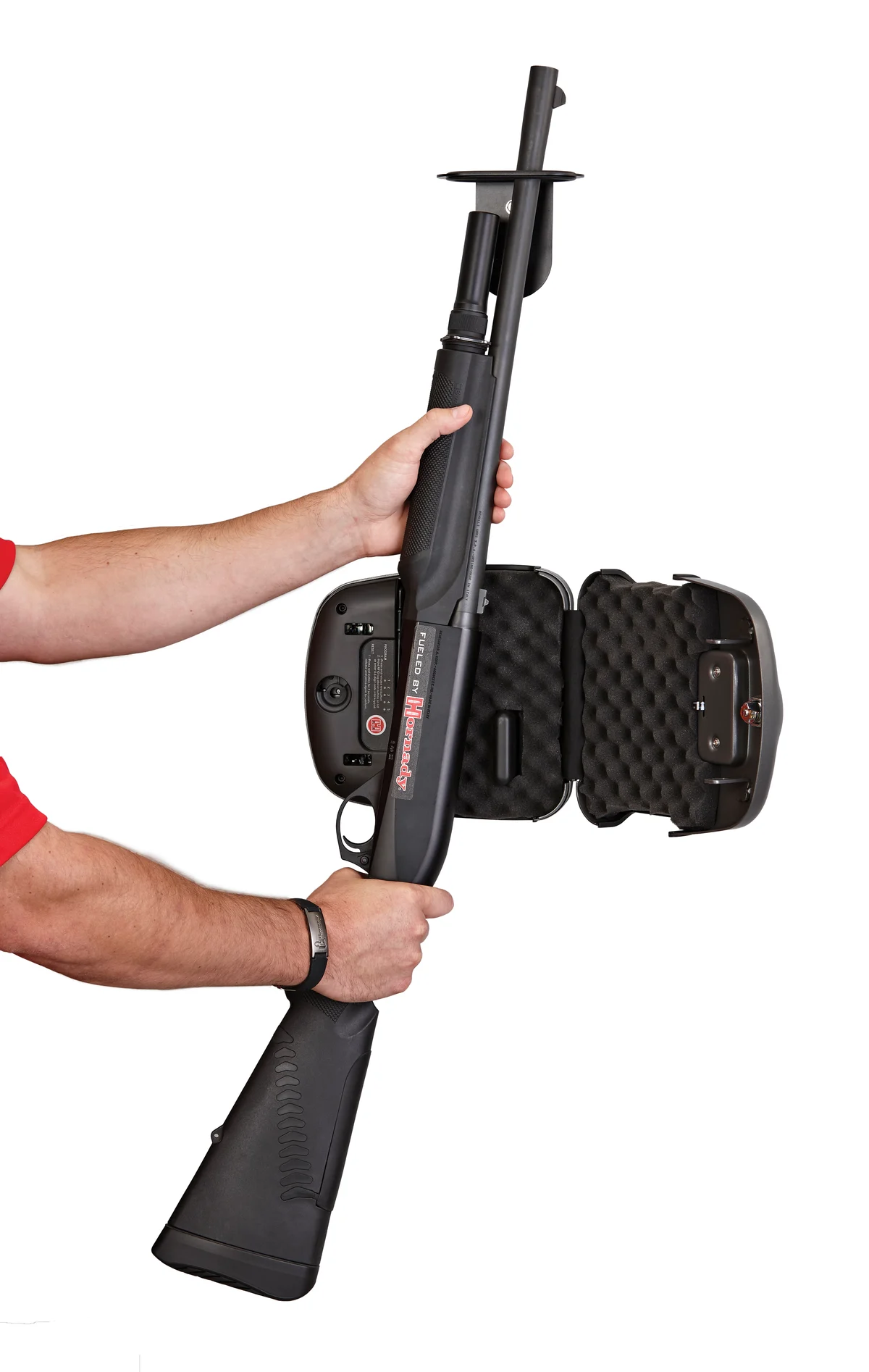 A shotgun being lifted out of a wall-mounted Hornady RAPiD Safe Shotgun Wall Lock