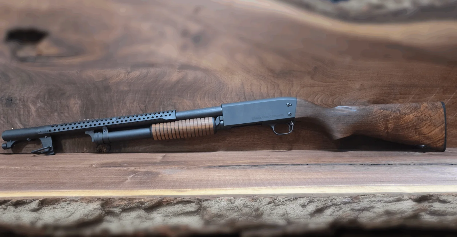 Ithaca Model 37 Trench Gun with heat shield and walnut stock on a live-edge walnut slab